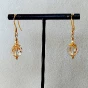 Boucles pendantes Swarovski dorées Golden Shadow